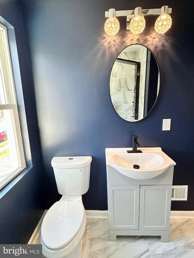 bathroom with vanity and toilet