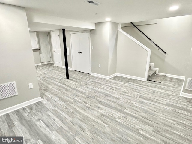 basement featuring light wood-type flooring