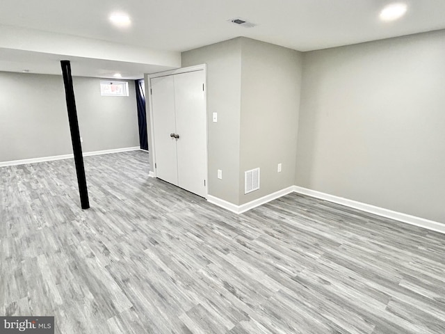 basement featuring light hardwood / wood-style floors