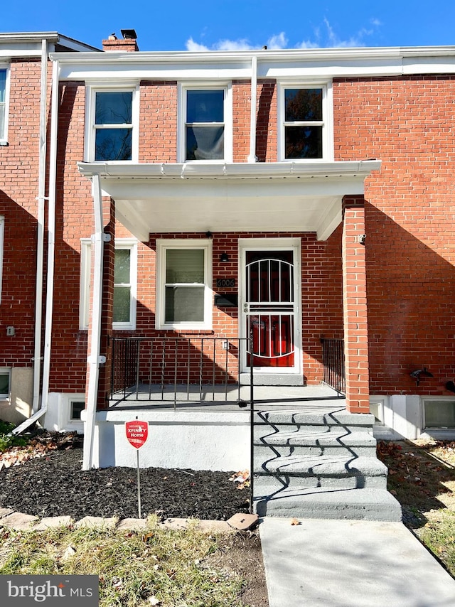 townhome / multi-family property with covered porch