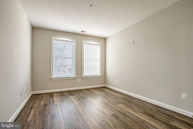 empty room featuring wood-type flooring