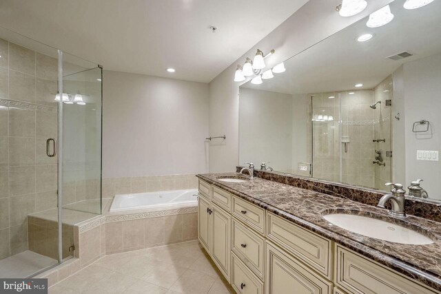 bathroom featuring tile patterned floors, vanity, and plus walk in shower