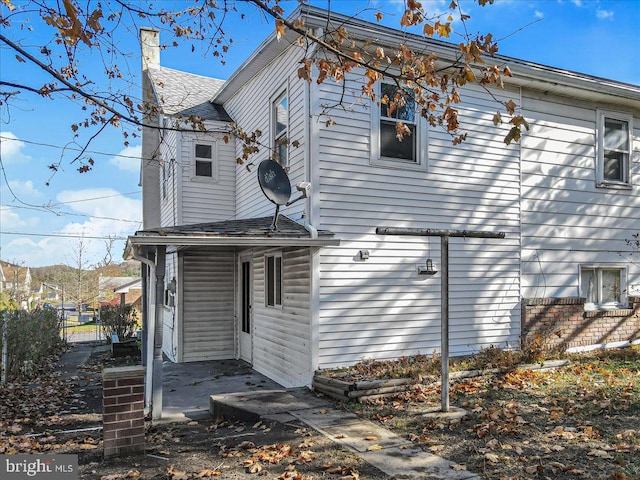 back of house with a patio area