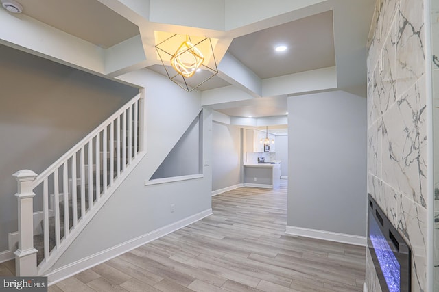 interior space with hardwood / wood-style flooring and a notable chandelier