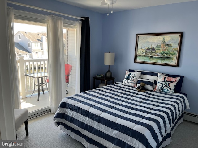 carpeted bedroom featuring a baseboard radiator, ceiling fan, and connected bathroom