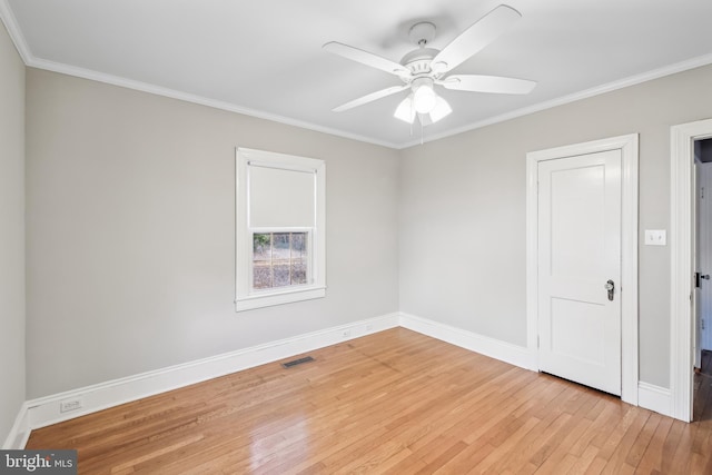 unfurnished room with ceiling fan, light wood-type flooring, and ornamental molding