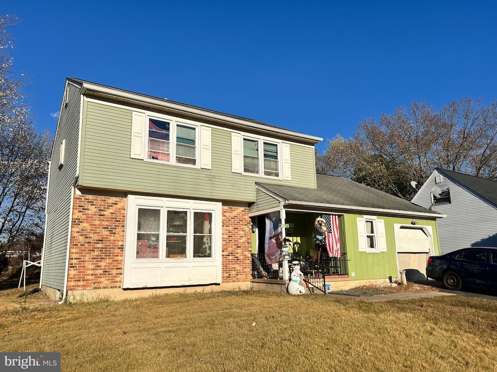 view of front property featuring a porch and a front lawn