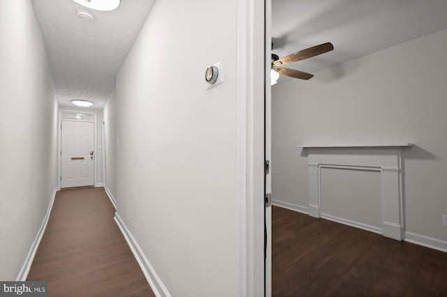 corridor with dark hardwood / wood-style floors