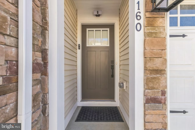 entrance to property featuring elevator