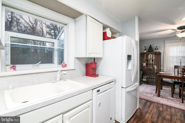 kitchen featuring dishwasher, a healthy amount of sunlight, white cabinetry, and dark wood-type flooring