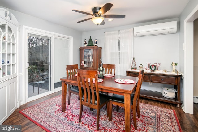 dining room featuring a wall mounted air conditioner, ceiling fan, and dark hardwood / wood-style flooring