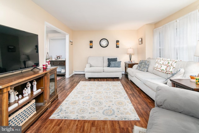 living room with a wall mounted air conditioner, dark wood-type flooring, and a baseboard radiator