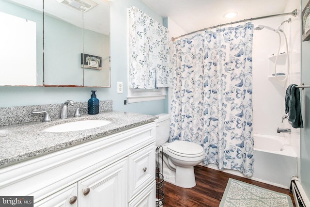 full bathroom featuring hardwood / wood-style floors, vanity, toilet, baseboard heating, and shower / tub combo