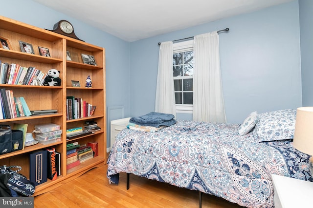 bedroom featuring wood-type flooring