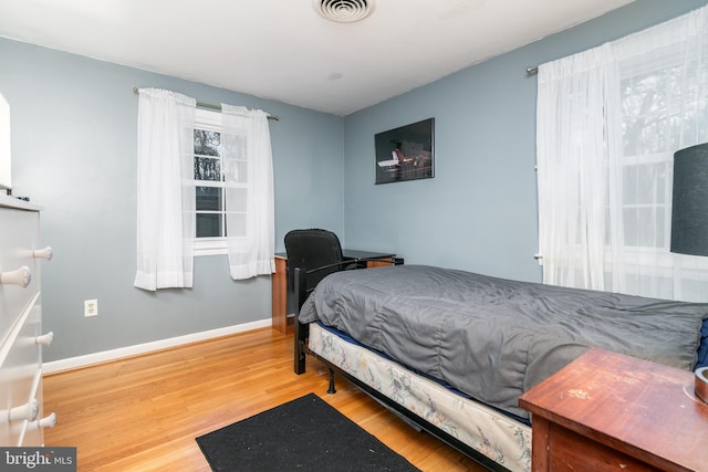 bedroom with wood-type flooring