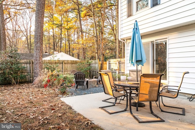 view of patio / terrace featuring an outdoor fire pit