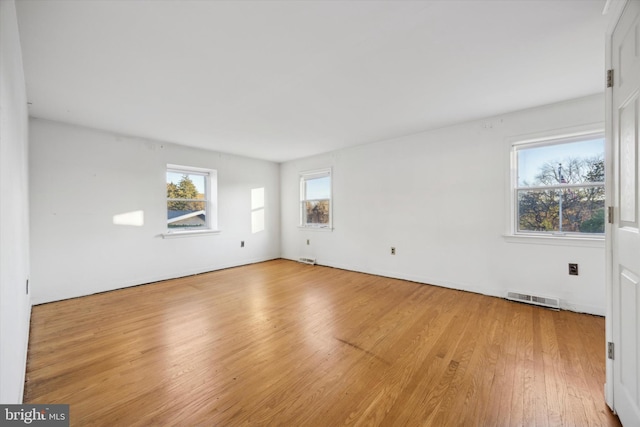 spare room with light wood-type flooring