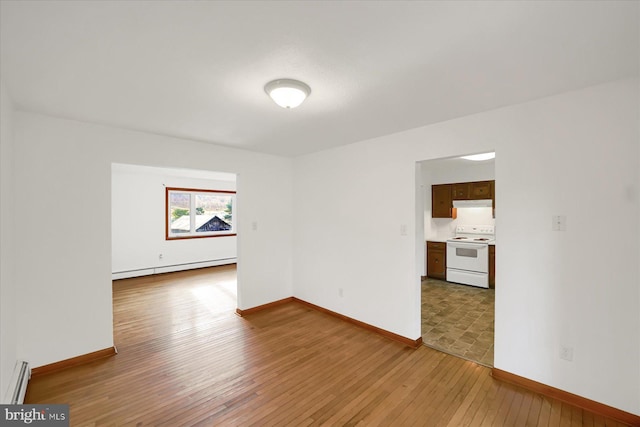 3315 E College Ave, Bellefonte, PA 16823 - empty room with a baseboard radiator, light wood-type flooring, and baseboards