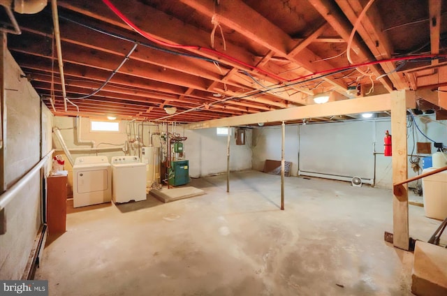 basement with separate washer and dryer and water heater