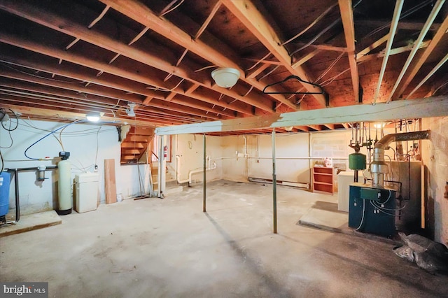 3315 E College Ave, Bellefonte, PA 16823 - unfinished basement featuring a water softener system, stairs, and washing machine and clothes dryer