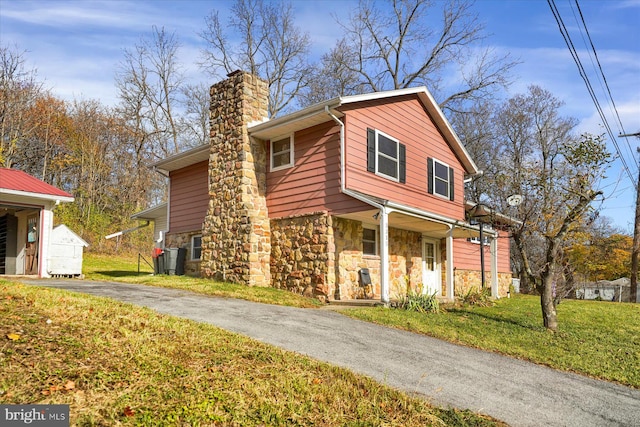 view of front of home with a front lawn and a porch