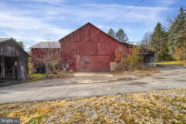3315 E College Ave, Bellefonte, PA 16823 - view of barn featuring asphalt driveway and a garage