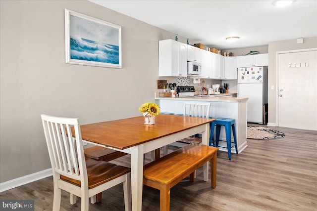 dining room featuring light hardwood / wood-style floors