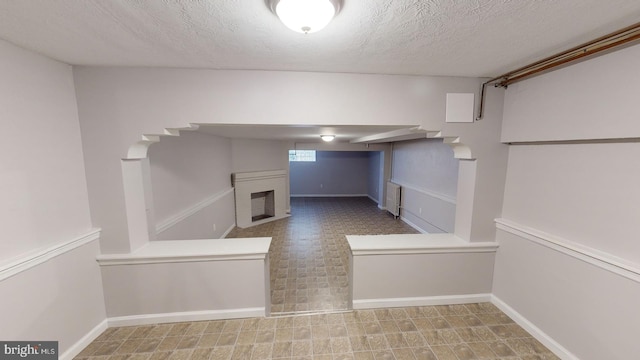 basement with a textured ceiling