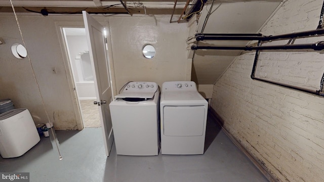 washroom featuring washer and dryer