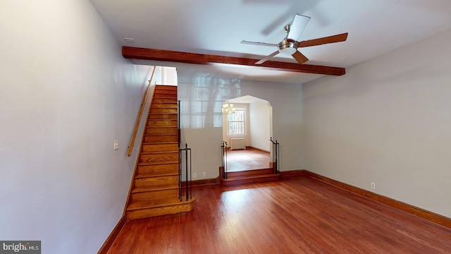 interior space featuring hardwood / wood-style flooring, ceiling fan, and beam ceiling