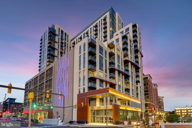 view of outdoor building at dusk