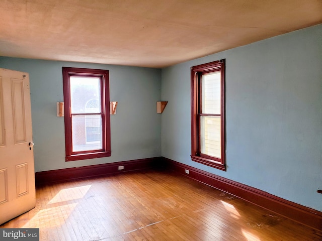 spare room with light hardwood / wood-style floors