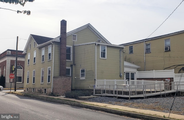 view of property exterior featuring a deck