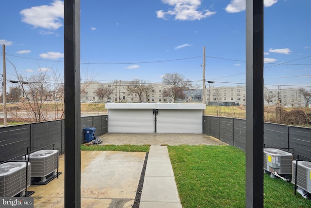 view of yard featuring a patio and central AC unit