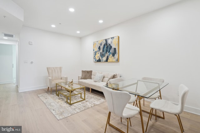 living room with light hardwood / wood-style flooring