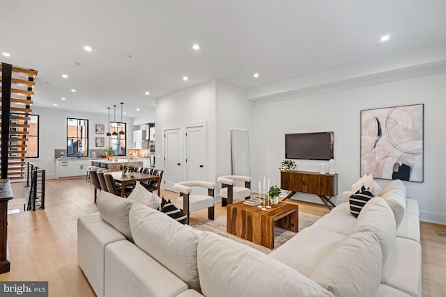 living room with light hardwood / wood-style flooring