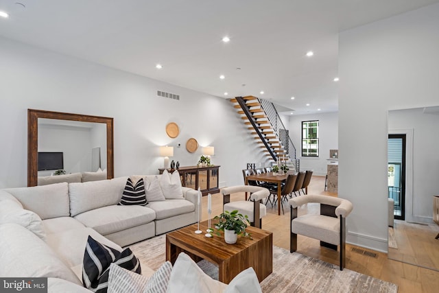 living room with light hardwood / wood-style flooring