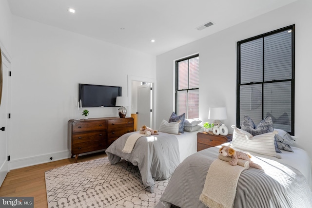 bedroom with light hardwood / wood-style floors