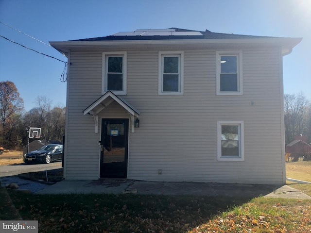 view of front of home with solar panels