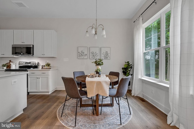 11 Rocky Green Ln, Gettysburg, PA 17325 - dining space featuring healthy amount of natural light, dark wood-style floors, and baseboards
