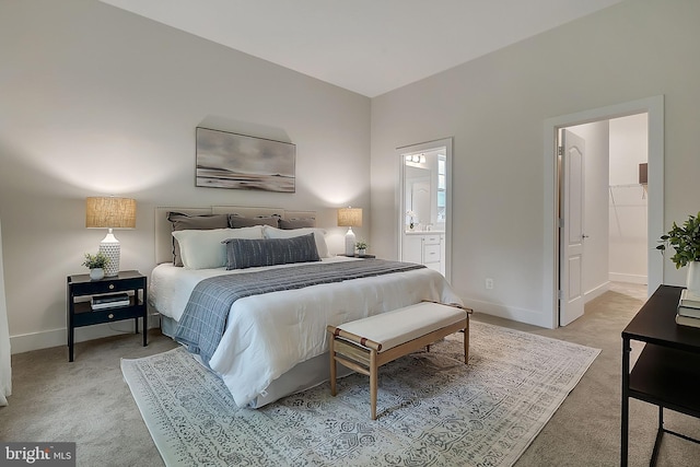 carpeted bedroom with ensuite bathroom