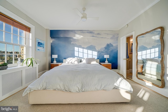 carpeted bedroom featuring ceiling fan, radiator heating unit, and crown molding