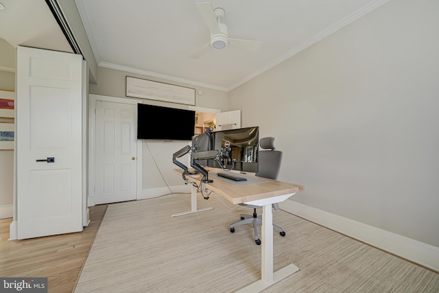 office space featuring light hardwood / wood-style floors, ornamental molding, and ceiling fan