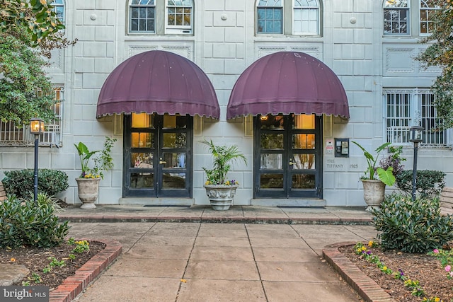 property entrance featuring french doors