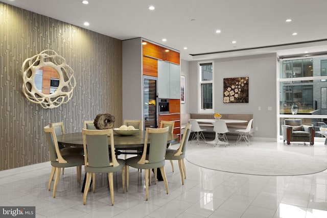 dining area with light tile patterned floors