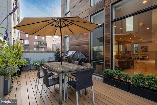 wooden terrace featuring grilling area