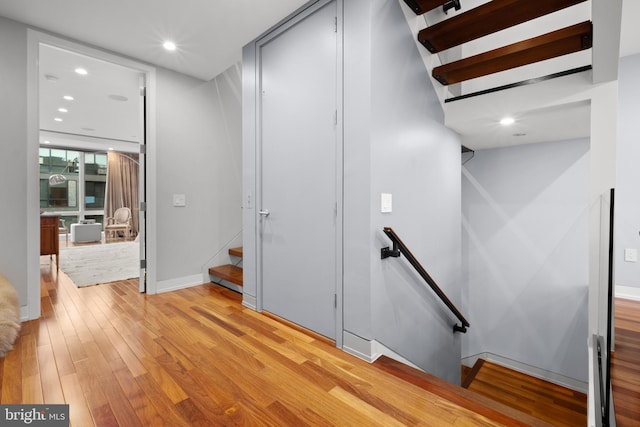 staircase featuring hardwood / wood-style floors