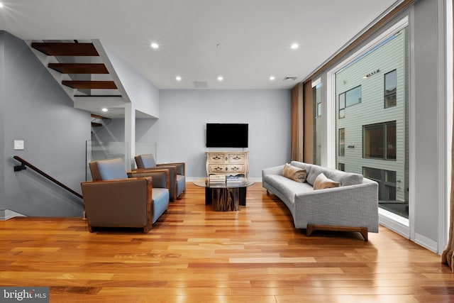 living room with light hardwood / wood-style flooring