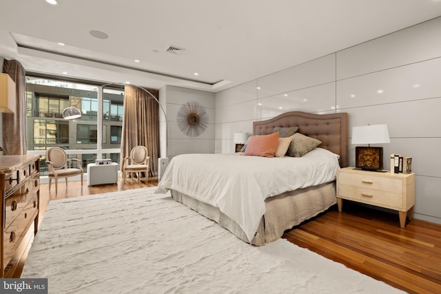 bedroom featuring hardwood / wood-style flooring