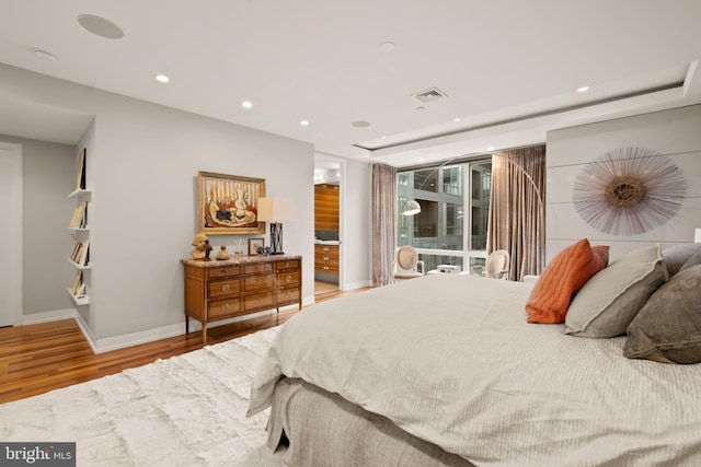 bedroom with light hardwood / wood-style floors